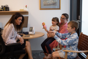 Dr Yael Gold with children at Family Clinics