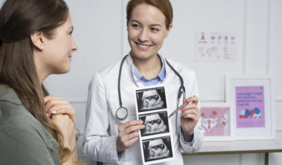Medium Shot Smiley Doctor Explaining Ultrasounds