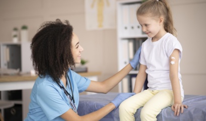 Young Doctor Making Sure Little Girl Is Fine After Vaccination